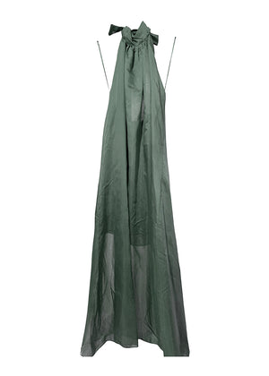 Green dress with sheer overlay on a white background