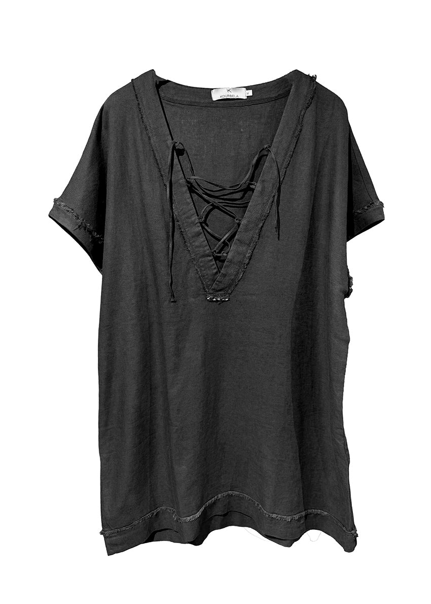 Black tunic with front detail made of a linen and bamboo blend with a linen look.It has a boxy shape with short sleeves and mini length. It has a plunging “V” neck with ribbons that tie in “X” shapes while the fringes at the seams highlight its raw look.