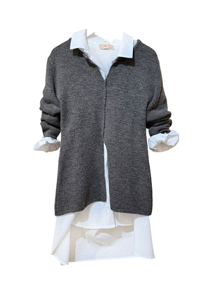 Gray sweater over a white shirt on a white background