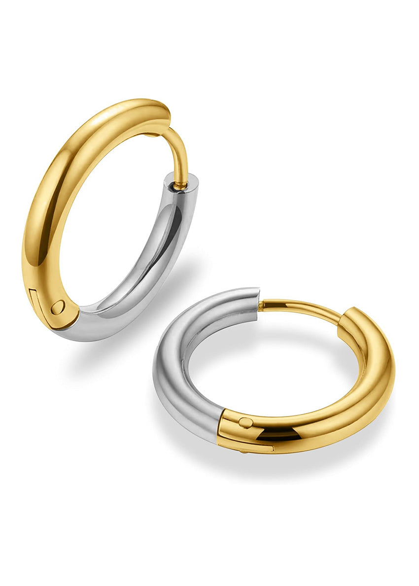 A pair of silver and gold round earrings with a geometric cross design at the center, displayed against a white background.