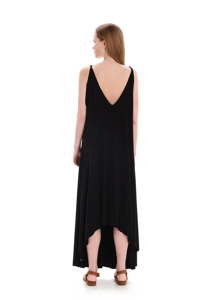 Black asymmetrical sleeveless dress, crafted from eco-friendly elastic EcoVero viscose. Featuring a relaxed fit and a soft, cozy texture. Its unique design includes a V-shaped back, which can be reversed for a boat neckline in front.