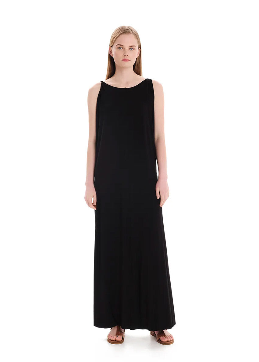 Black asymmetrical sleeveless dress, crafted from eco-friendly elastic EcoVero viscose. Featuring a relaxed fit and a soft, cozy texture. Its unique design includes a V-shaped back, which can be reversed for a boat neckline in front.