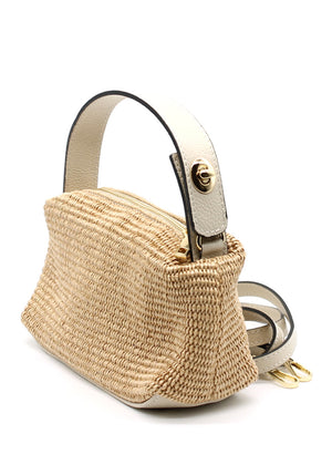 Beige woven handbag with a metal handle on a white background
