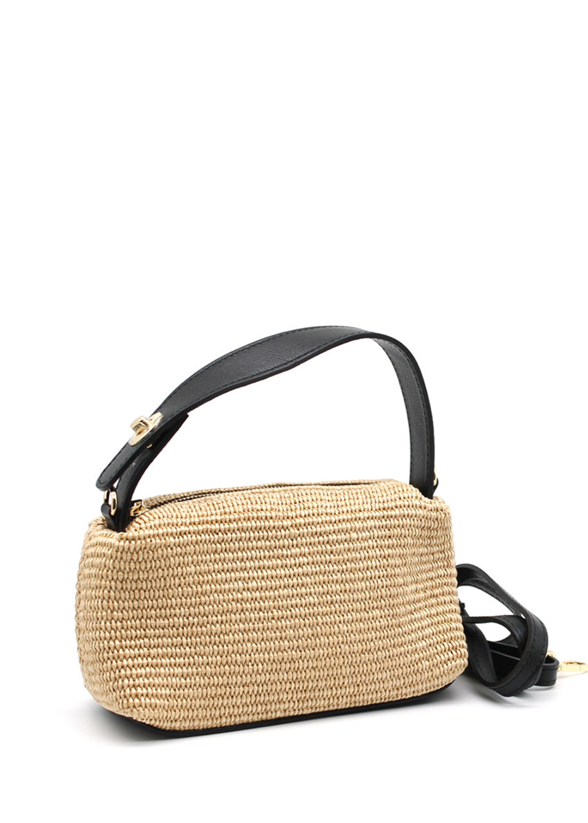 Woven handbag with black handle and strap on a white background