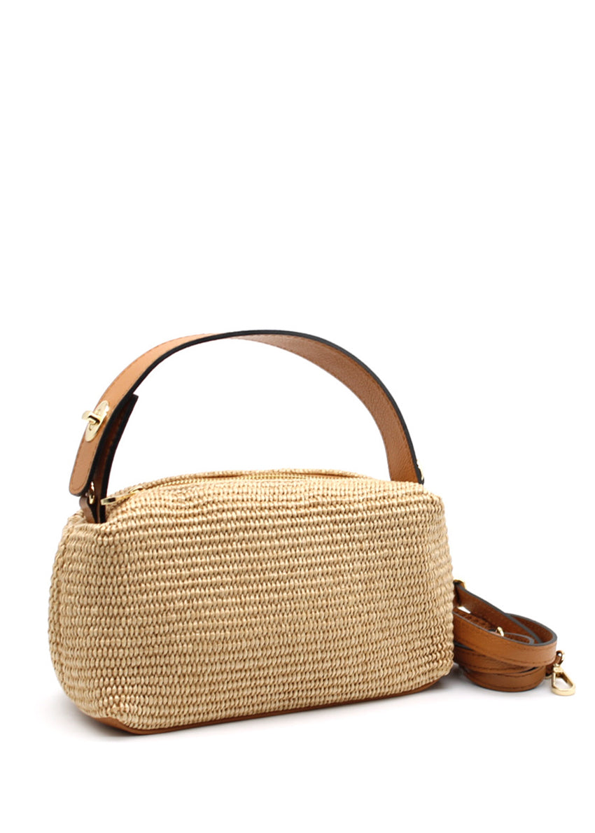 Woven handbag with leather handle and strap on a white background