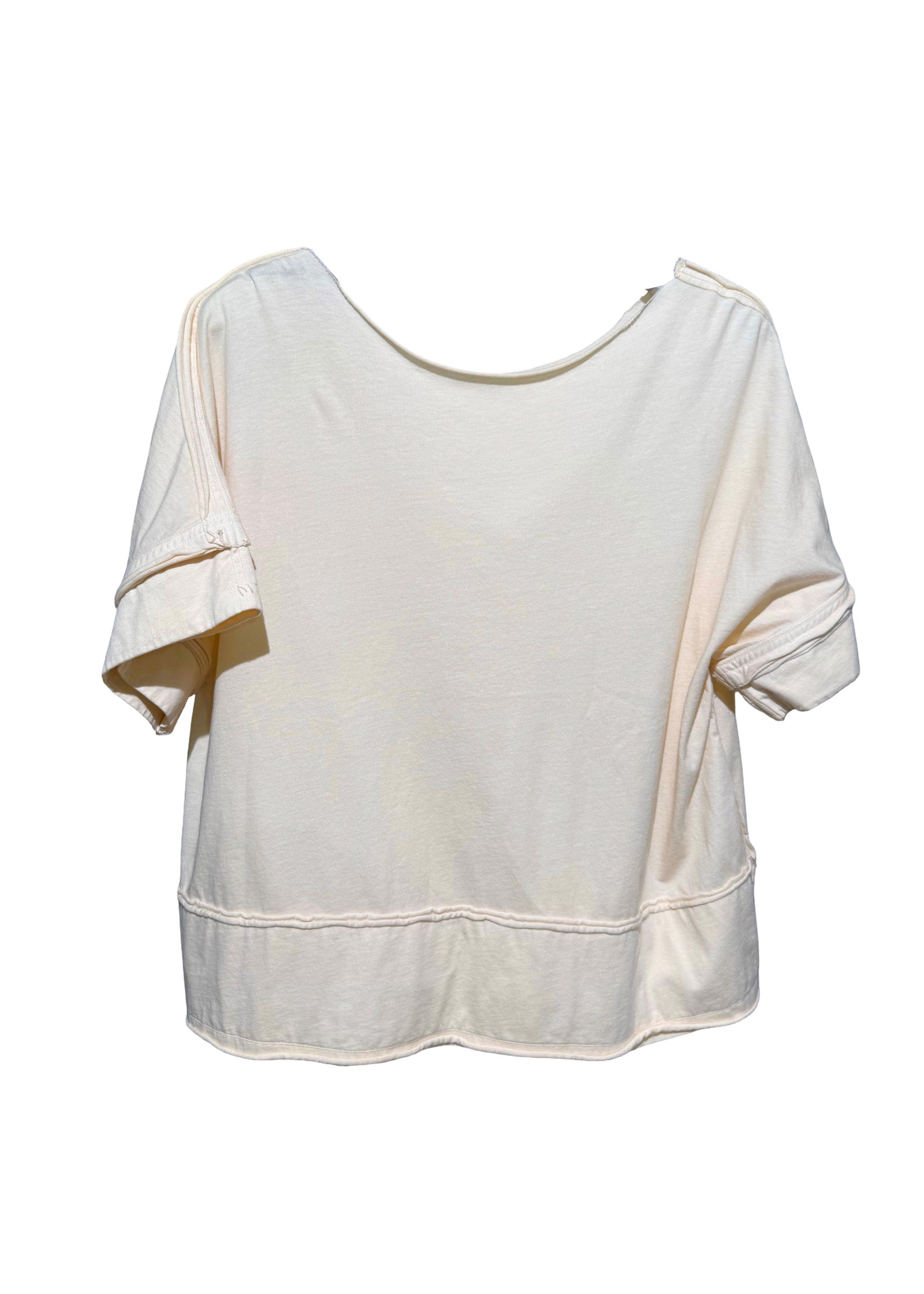 White blouse with gold accents on a white background