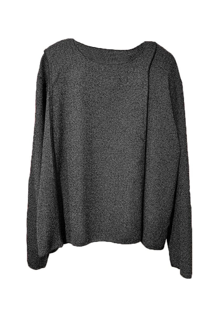 A gray unisex top with a crepe texture, featuring a relaxed fit with slightly dropped shoulders and diagonal seams along the upper sleeves.