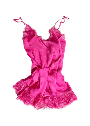 Deep pink lace top with adjustable straps and delicate lace trim on a white background 