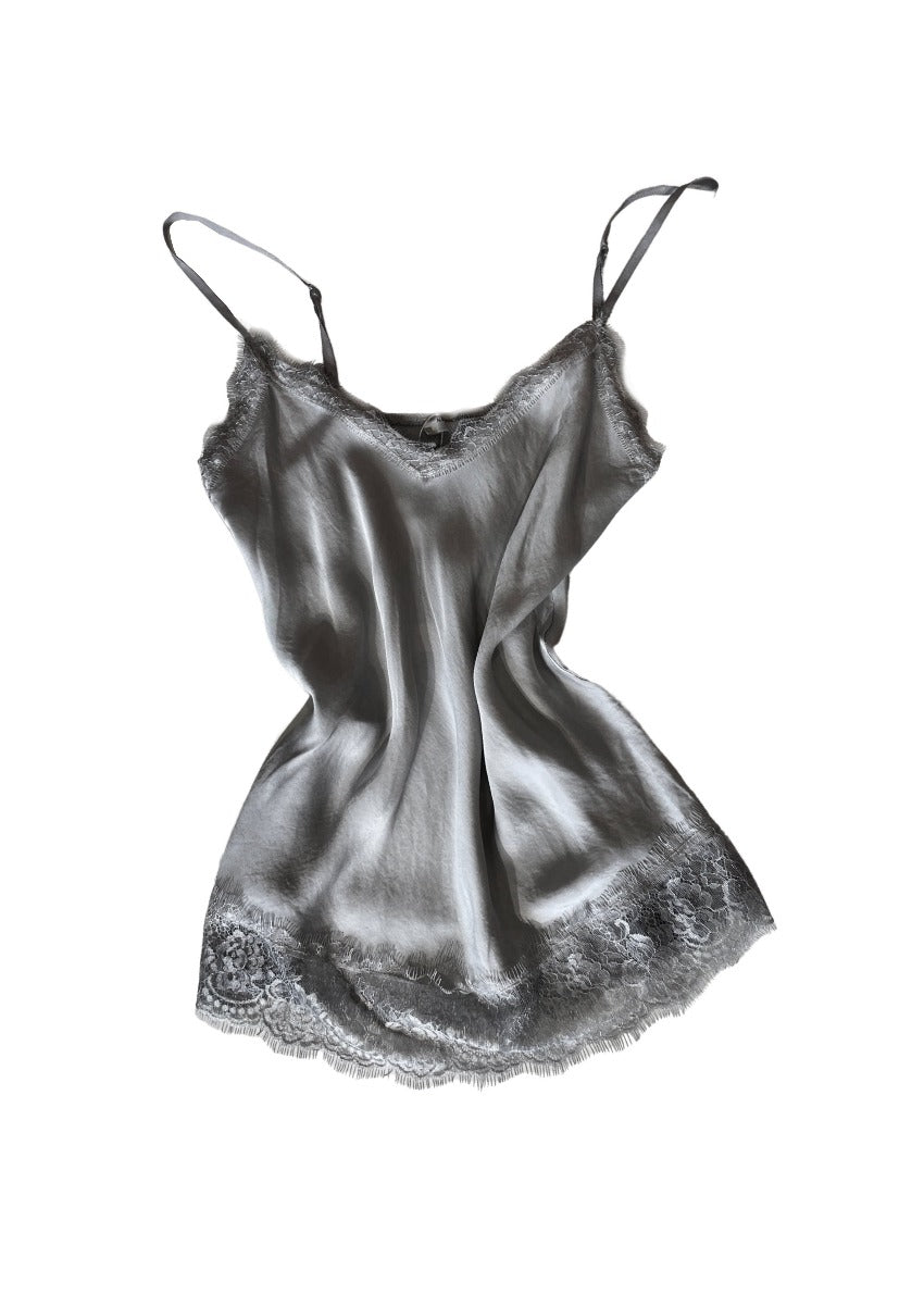 Dim grey lace top with adjustable straps and delicate lace trim on a white background 