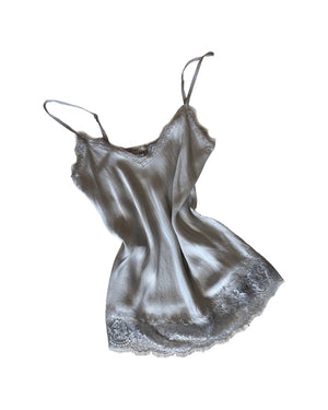 Grey lace top with adjustable straps and delicate lace trim on a white background 