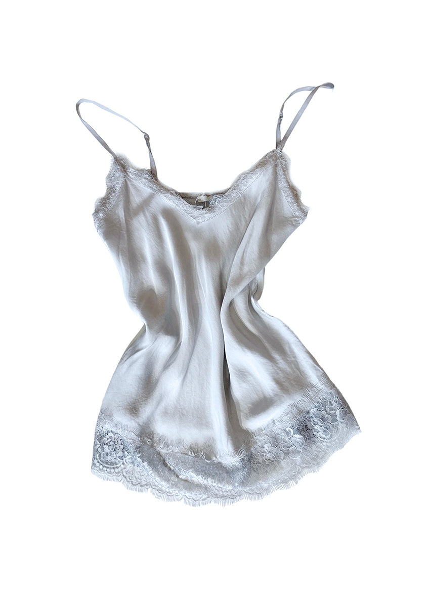 Light blue lace top with adjustable straps and delicate lace trim on a white background 