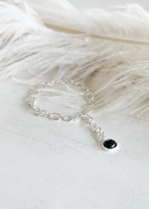 Babbett anklet, crafted with gold plating and accented by a striking black onyx stone