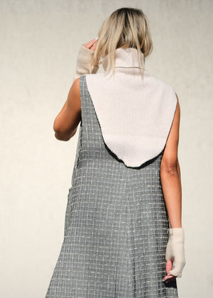 A white, ribbed, knitted neck collar