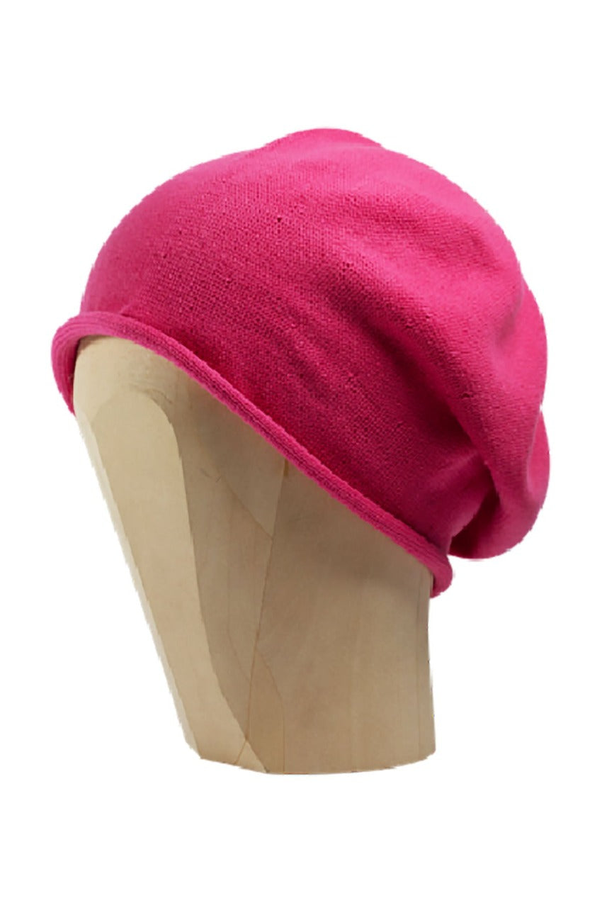 Deep pink beanie beret on a white background 
