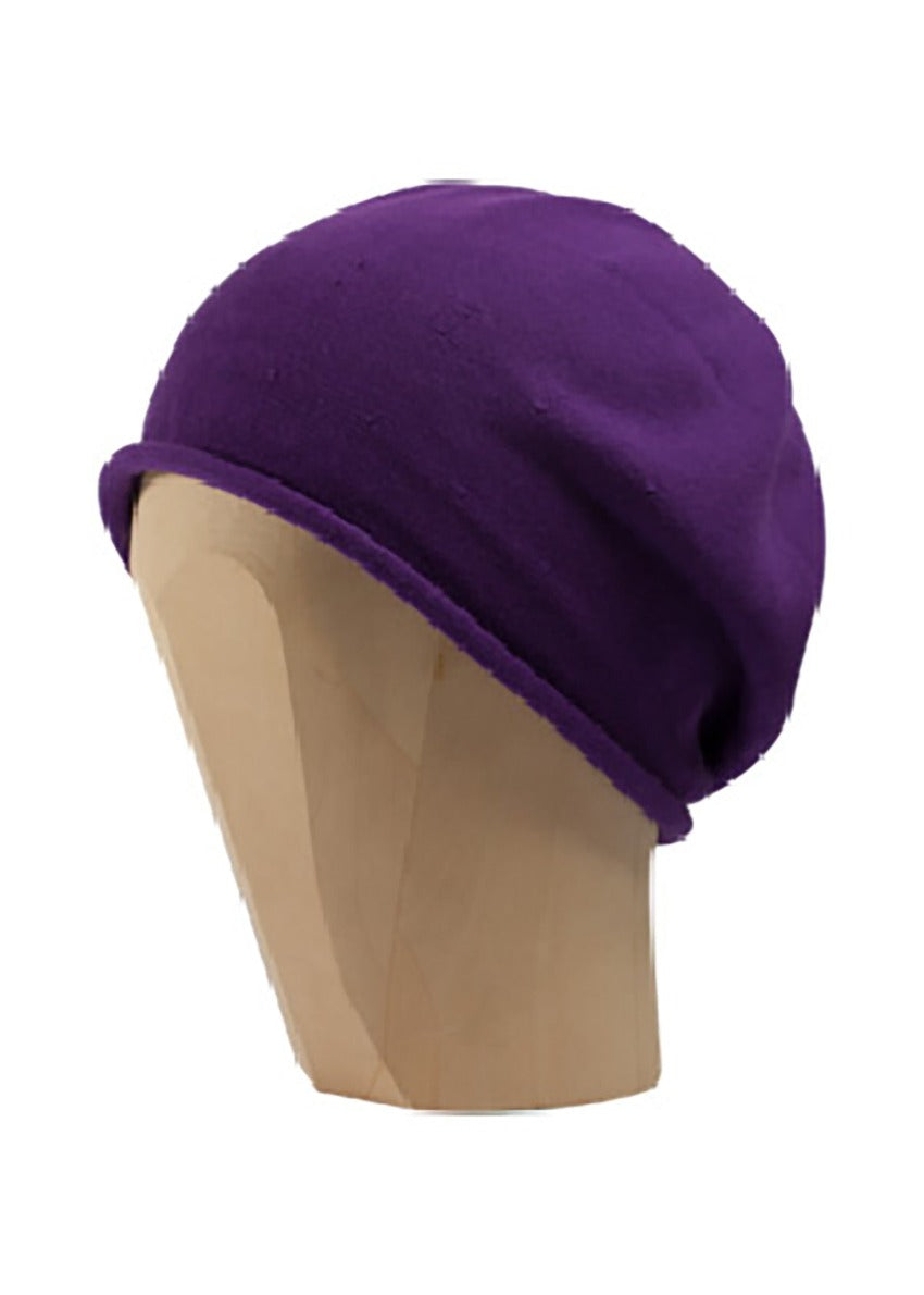 Purple beanie beret on a white background 