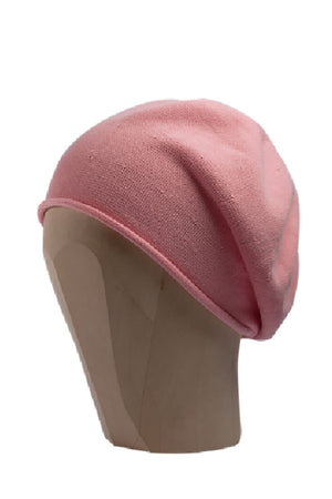 Pink beanie beret on a white background 