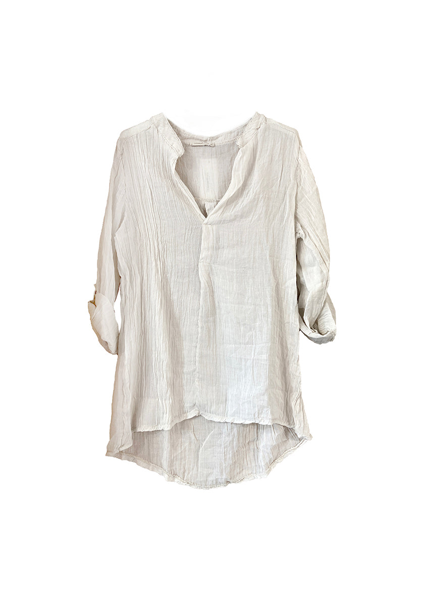 A beige shirt on a white background 