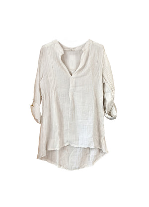 A beige shirt on a white background 