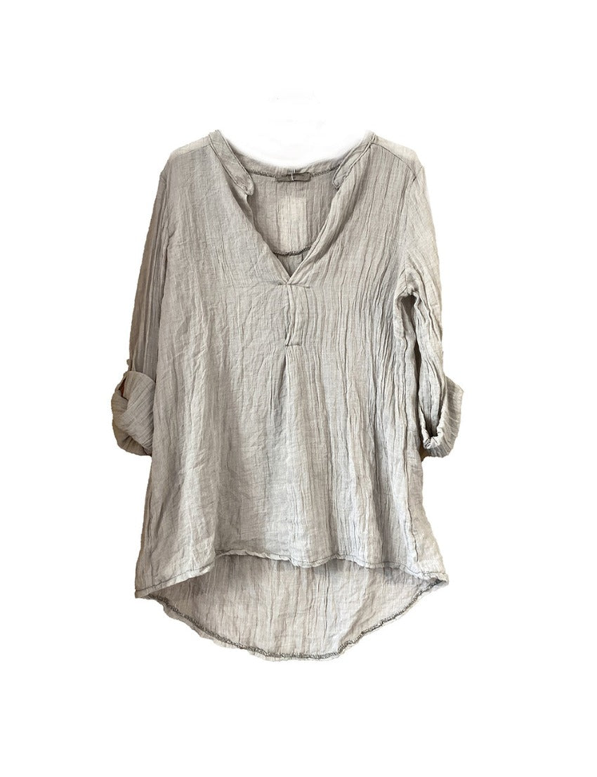 A dark beige khaki shirt on a white background 