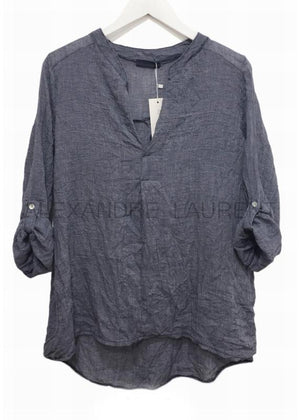 A grey shirt on a white background 