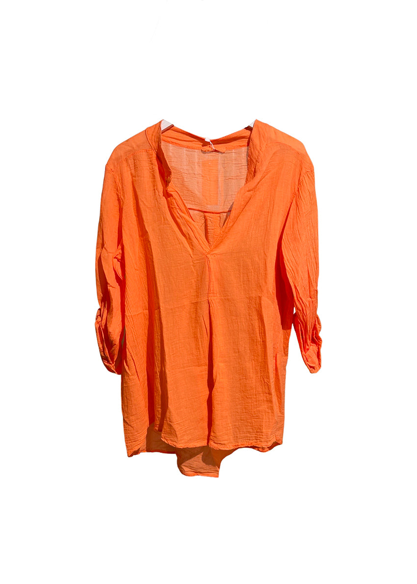 A orange shirt on a white background 