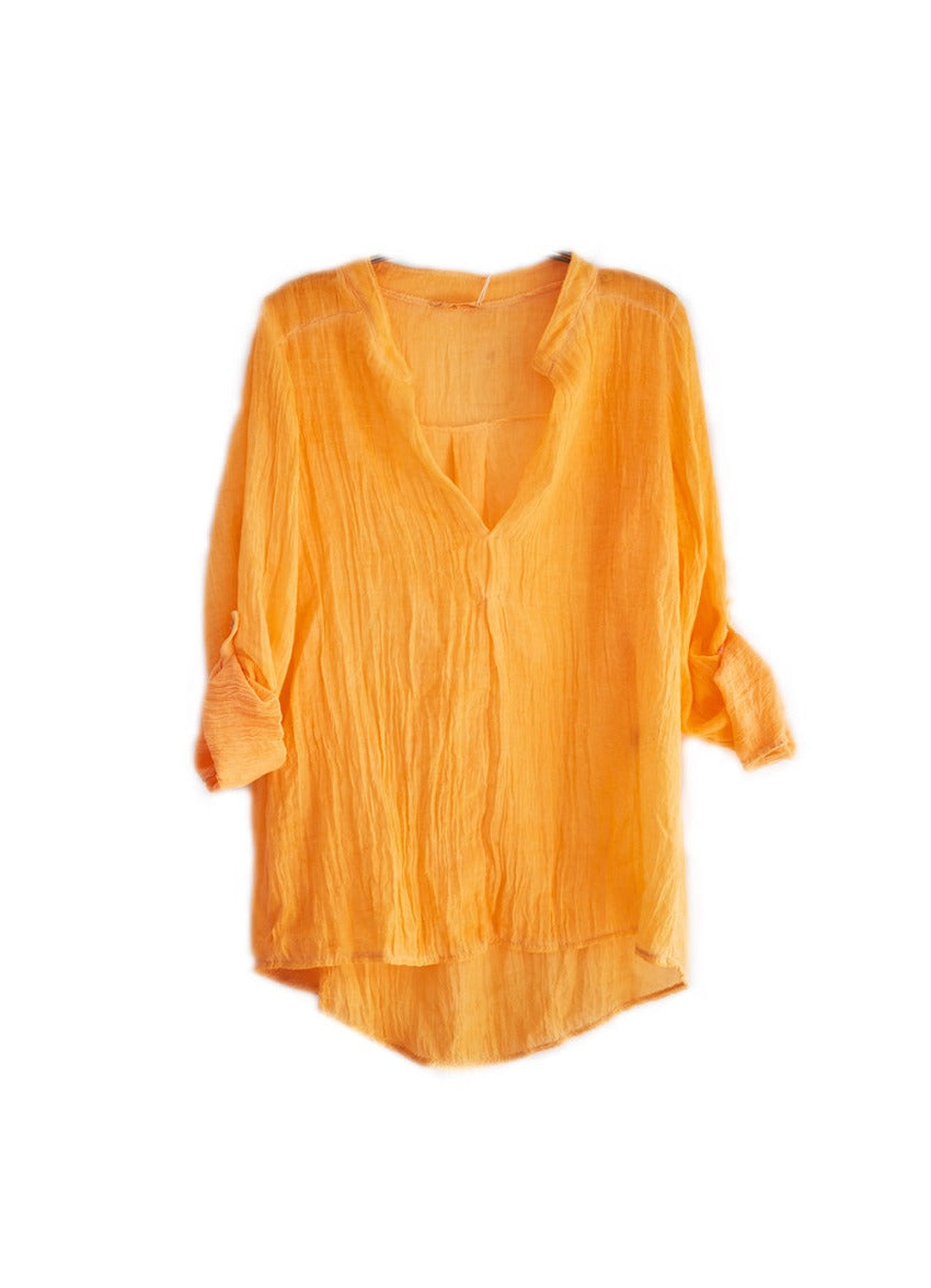 A orange shirt on a white background 