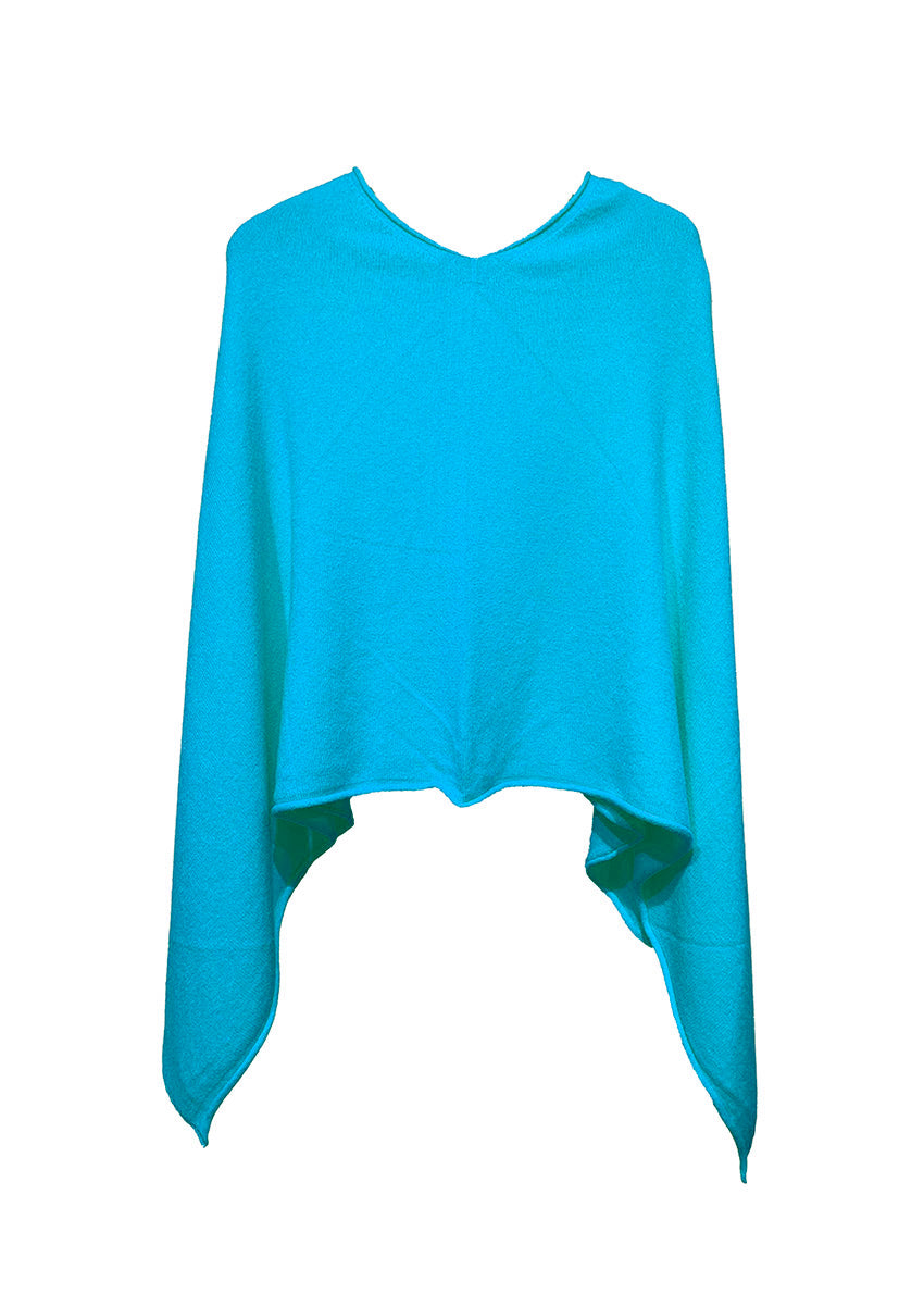 A dark turquoise poncho on a white background 