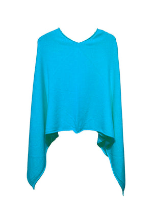 A dark turquoise poncho on a white background 