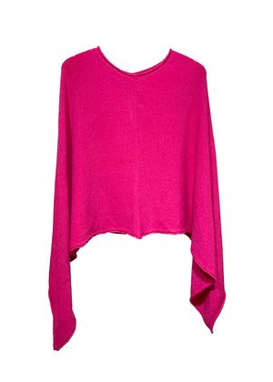 A deep pink poncho on a white background 
