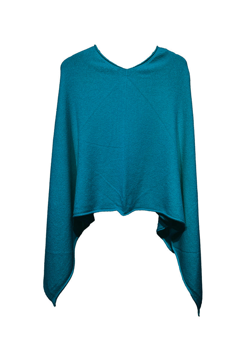 A teal poncho on a white background 