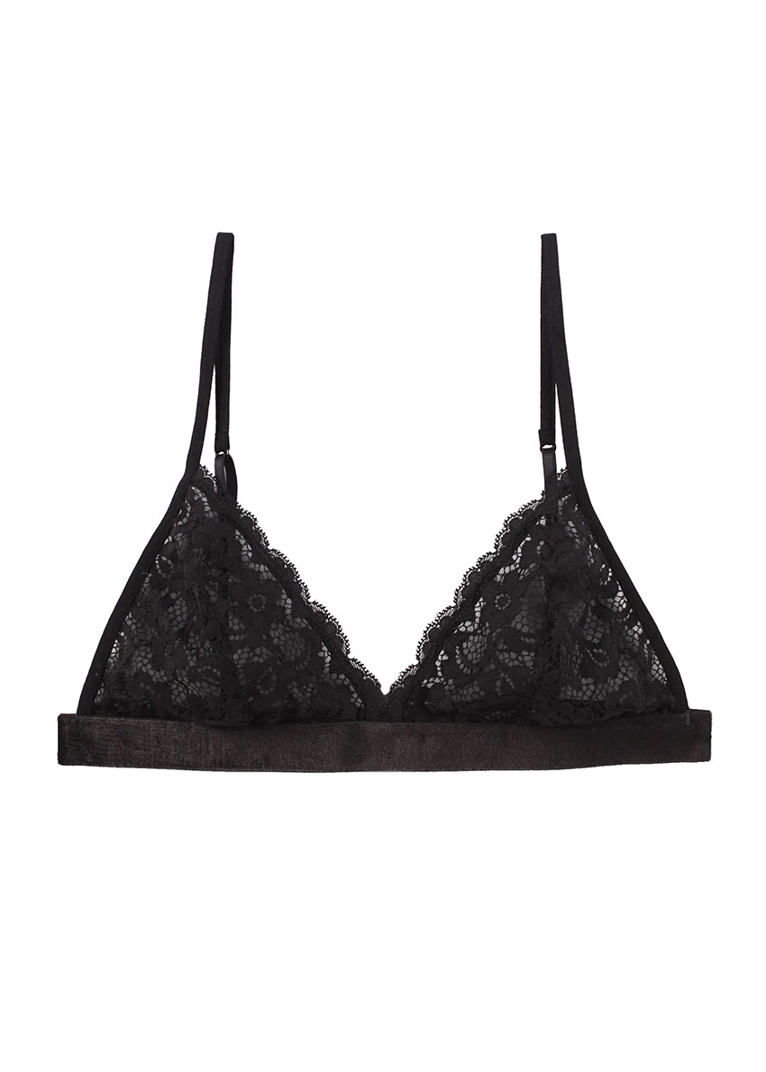 A woman wearing a black lace triangle bra with adjustable straps.