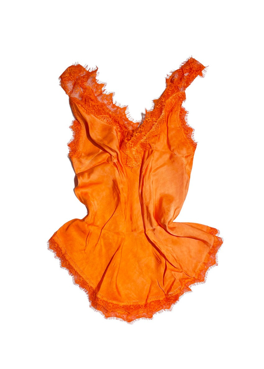 A dark orange lace V-neck tank top with delicate lace trim on a white background.