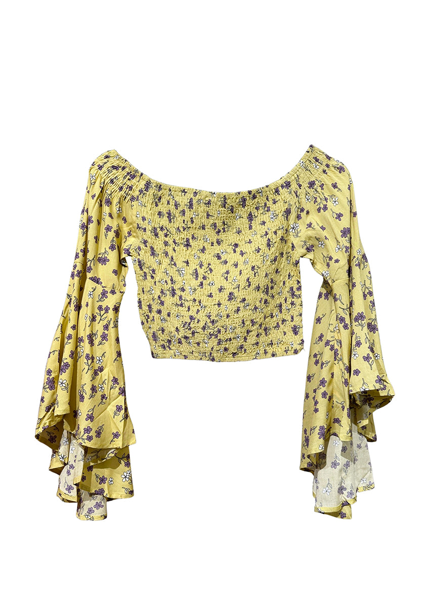 A yellow floral print crop top with asymmetrical sleeves