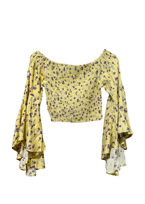 A yellow floral print crop top with asymmetrical sleeves