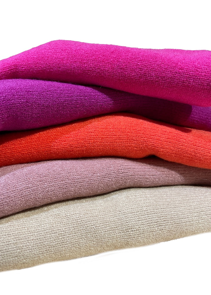 Different colours of  turtleneck sweaters with ribbed sleeves