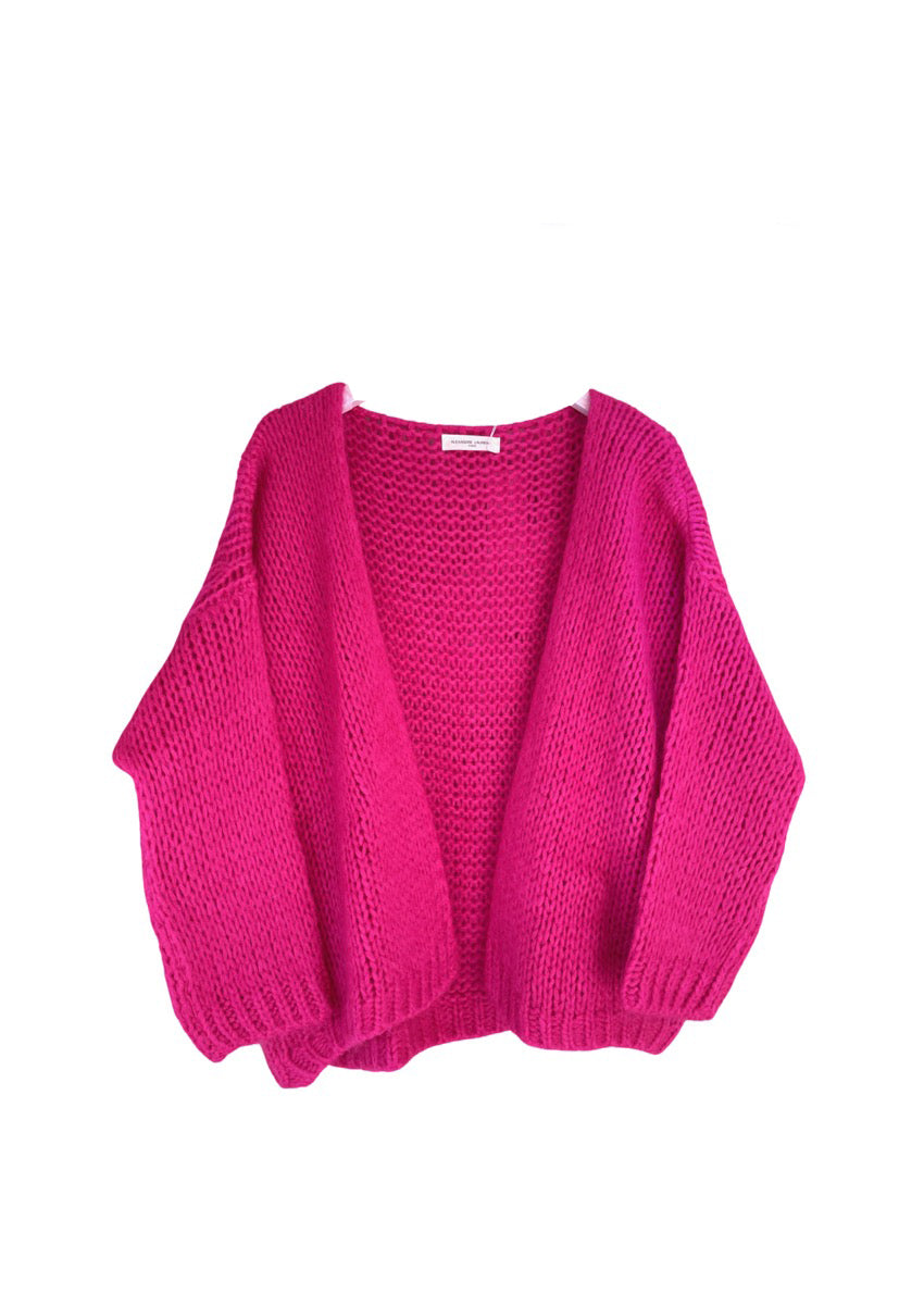A hot pink knit cardigan on a white background 
