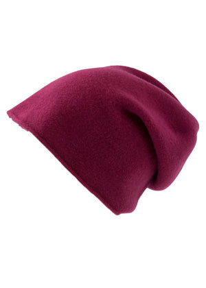 A fuchsia wool beanie on a white background 