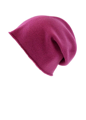 A medium violet red wool beanie on a white background 