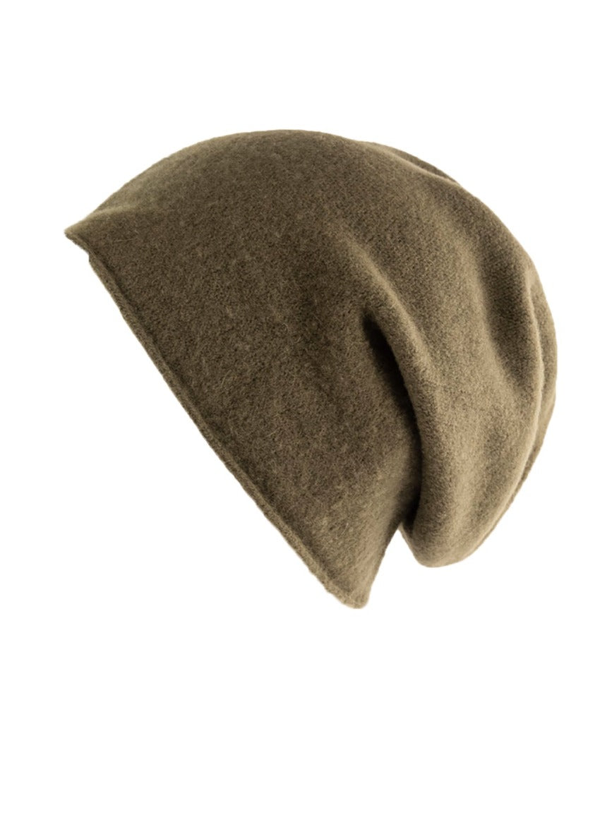 A olive wool beanie on a white background 