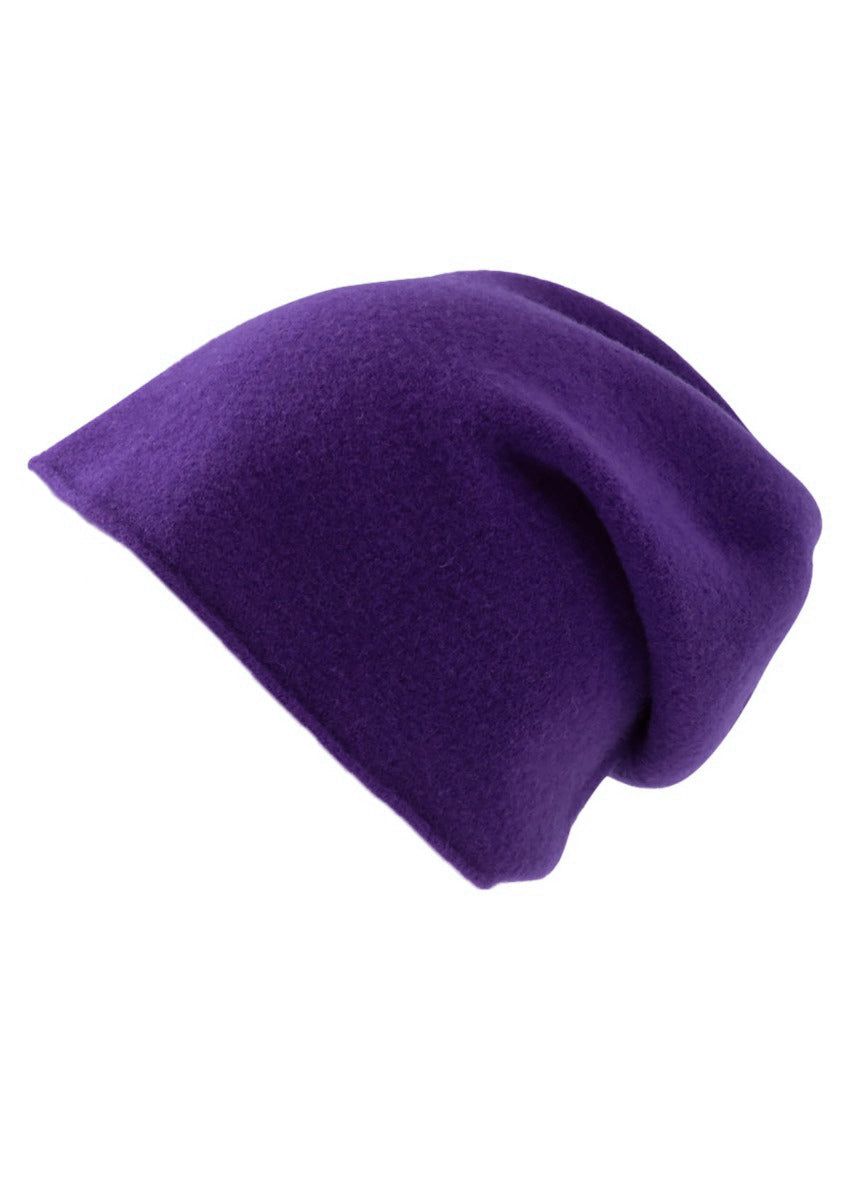 A purple wool beanie on a white background 