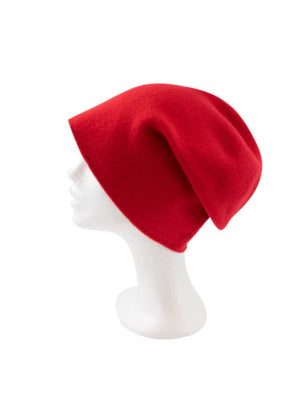 A red wool beanie on a white background