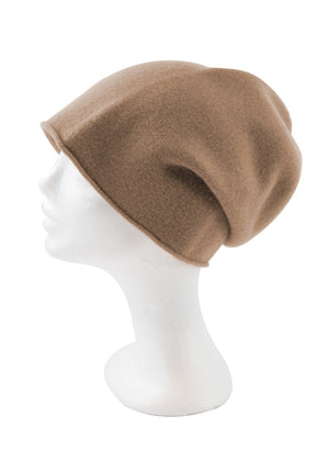 A tan wool beanie on a white background 