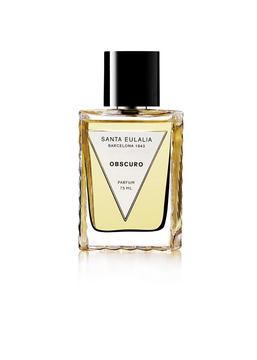A bottle of Santa Eulalia Obscuro perfume with a clear label and a black cap, containing a woody spicy fragrance.