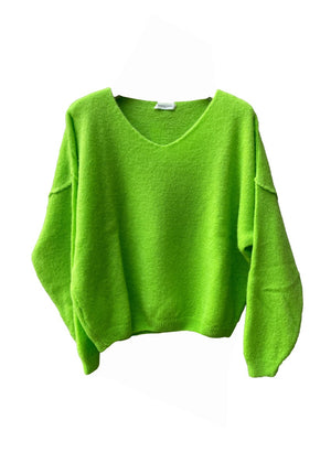 A green, loose-fitting, long-sleeved sweater with a deep V neckline.