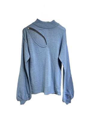 A very soft, classic blue sweater, medium length, with a wide slits on the clavicle, shoulder side of the body. Made of merino wool, cashmere and other soft fibres.