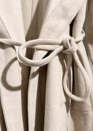 A beige wool coat close up knot