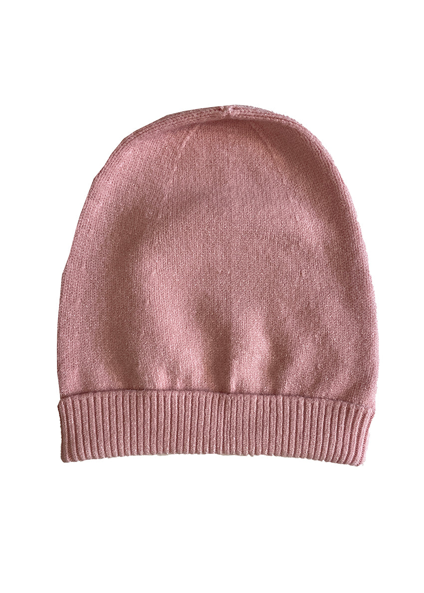 Light pink warm beanie on a white background