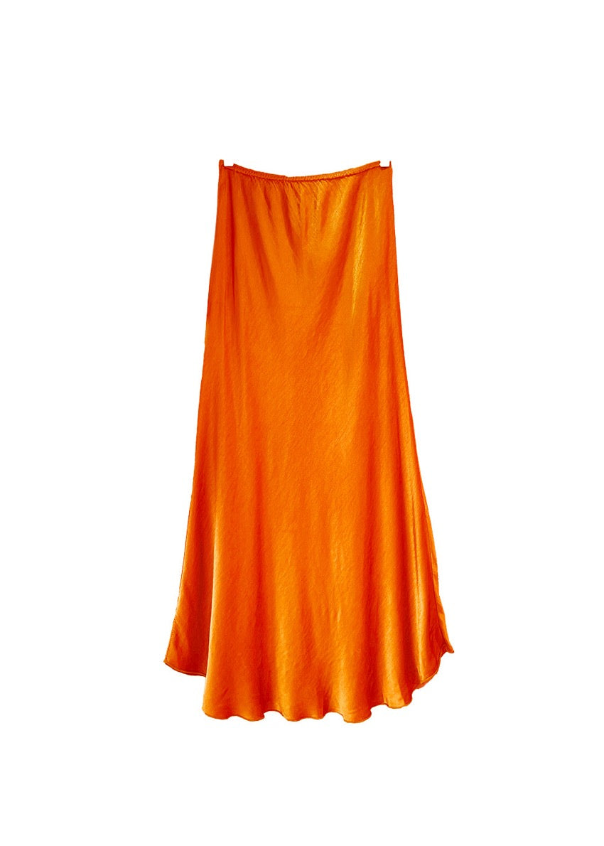 A orange satin midi-length skirt with a high-rise waist and a flaring hem.