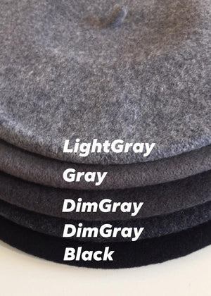 A different shades of dark colours of wool berets