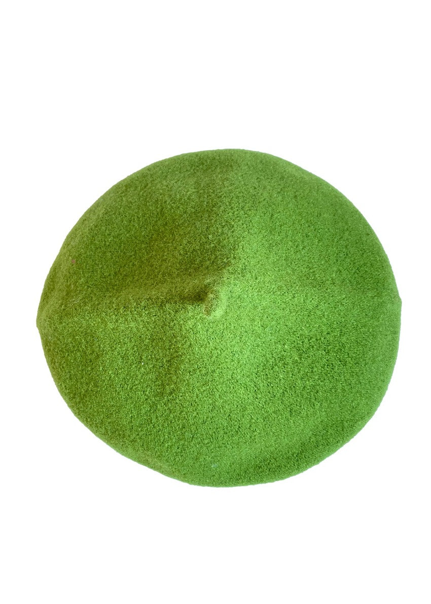 A green wool conical beret on a white background 